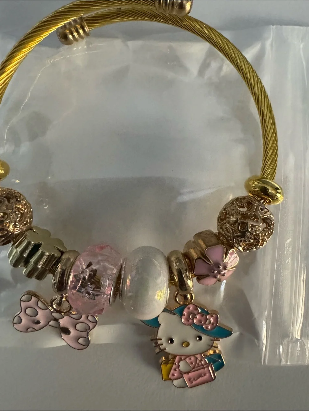 Hello Kitty Gold-Tone Charm Bracelet - Pink Accents